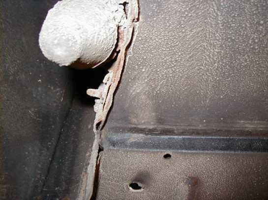 Picture 1 View of the bump stop from below. Rust sits between the bump stop assembly and the inner fender