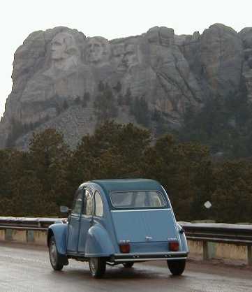 World famous rock group posing with 2CV